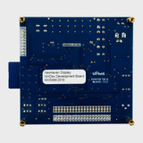 The back of a blue circuit board with the top of an SD card showing over the left edge.