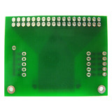 The back of a green circuit board with 2x18 thru-hole connection points.