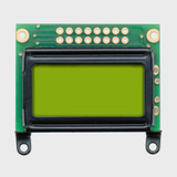 Front view of an unlit 8x2 character LCD with a blank STN+ yellow-green screen.