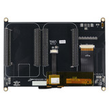 A black circuit board on the back of a 7-inch TFT LCD with various components and two cape slot connectors.