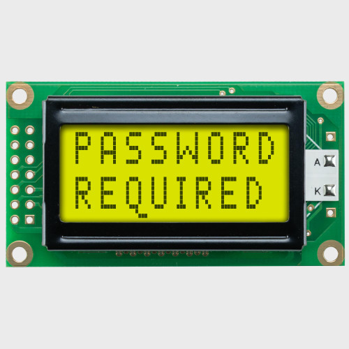 8x2 문자 LCD의 정면 모습으로, 백라이트가 적용된 황록색 화면에 첫 번째 줄에는 'Password'라는 단어가, 두 번째 줄에는 'Required'라는 단어가 어두운 텍스트로 표시되어 있다.