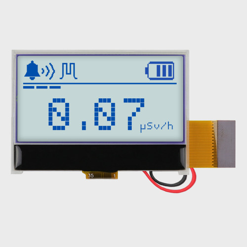 Front view of a 128x64 graphic COG LCD with attached cables, showing radiometer data in blue pixels on a gray background display.