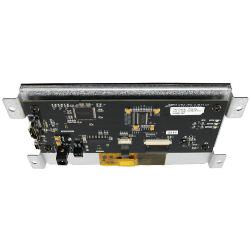 An angled view of A black HDMI controller circuit board featuring various components mounted to the backside of a 7.0-inch TFT LCD, with the top edge tipped toward the camera to show its slim profile.