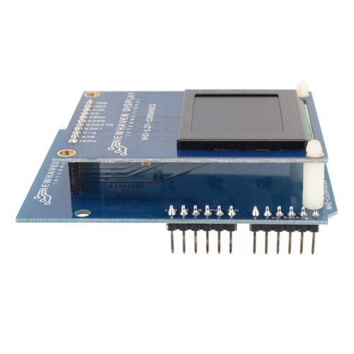 An angled side view of an Arduino shield with an integrated OLED display, showcasing its depth and connection pins.