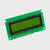 An inactive STN+ yellow-green LCD with the left side lower in the frame and angled slightly toward the viewer.
