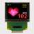 Front view of a 128x96 pixel graphic OLED display with an attached 30-pin FFC cable showing a full-color heart rate readout and graphic on a black background.