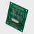 A green PCB for a graphic OLED display module showcasing its 2x10 thru hole connection points and various other components angled with the right side closer to the viewer to showcase its slim profile.