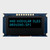 Front view of a 16x2 character modular OLED display on a blue PCB showing illuminated blue text on a black background.