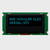Front view of a 16x2 character OLED display module on a green PCB showing illuminated blue text on a black background.
