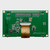 Back view of the green PCB for a graphic OLED display module, showcasing the 1x20 thru hole connections and various other components.