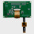 Back view of the green PCB for a graphic OLED display module, showcasing the 1x20 thru hole connections, the 6-pin touchscreen control cable, and various other components.