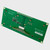 A green PCB for a graphic OLED display module showcasing its 1x20 thru hole connection points and various other components angled with the right side closer to the viewer to showcase its width.