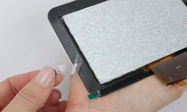 Mounting adhesive on an LCD display.
