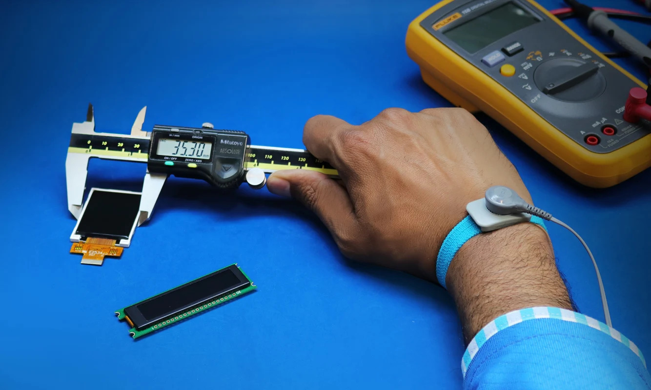 Engineer measuring LCD display