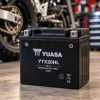Yuasa YTX20HL 12V maintenance-free AGM motorcycle battery in a workshop