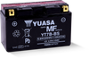 Yuasa YT7B-BS YUAM62T7B maintenance-free AGM 12-volt motorcycle battery showing compact low-profile dry-charged black casing and top terminals isolated against a solid white studio background.