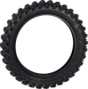 A high-resolution studio product photograph of the Dunlop Geomax MX14 rear off-road motorcycle tire in 90/100-16 sizing, isolated against a seamless, solid white background. The tire is shown standing vertically at a three-quarter angle to highlight its specialized sand and mud scoop tread pattern. Tall, V-shaped paddle knobs run down the center for maximum drive traction in loose terrain, flanked by aggressive, staggered shoulder lugs, with embossed "GEOMAX MX14" branding clearly visible on the matte black sidewall.