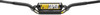 A high-resolution studio product photograph of the ProTaper Micro Schoolboy High Handlebar in a black finish, set against a clean white background. Displayed from a front-facing studio angle, the handlebar is precision-manufactured from high-strength 2000-series T6 aluminum alloy with a cold-forged crossbar. Specifically tailored for taller or advancing youth riders on mini motorcycles requiring increased vertical rise, it features ProTaper's specialized abrupt-taper design with reduced-diameter grip ends to allow smaller hands a secure, full-hand grip for improved control, while maintaining a standard 7/8-inch clamp and control clamping area. The assembly includes knurled clutch-side tubing to prevent grip slippage, laser-etched alignment grid markings for precise angle adjustment, and a high-density crossbar pad with signature ProTaper branding.