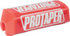 A high-resolution studio product photograph of a ProTaper 2.0 Square Bar Pad in Race Red, set against a clean white background. Displayed at a front-three-quarter angle, the high-density molded closed-cell foam pad features a vibrant red vinyl cover, bold white block "PROTAPER" logo graphics printed across the front, and a streamlined square profile with cutouts designed specifically for oversized 1-1/8" un-braced handlebars.