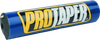 A high-resolution studio product photograph of a ProTaper Molded 8-inch Round Bar Pad in vibrant blue, set against a clean white background. Displayed at a front-three-quarter angle, the cylindrical high-density molded foam handlebar pad features a glossy bright blue vinyl cover, bold white and yellow "PROTAPER" block logo graphics printed across the front, and black molded end caps designed to fit traditional crossbar-equipped handlebars.