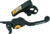 A high-resolution studio product photograph of a ProTaper XPS Profile Pro Front Brake Lever designed for 2006–2013 KTM models, set against a clean white background. Displayed at a front-three-quarter angle, the premium hard-anodized black aluminum brake lever features ProTaper's Cross-Pivot System (XPS) joint for multi-directional folding durability, a gold-anodized reach-adjuster dial, and crisp laser-etched "PROTAPER" branding along the lever blade.