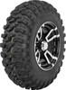 A high-resolution studio product photograph of a QuadBoss QBT446 Radial Utility ATV/UTV tire in size 26x11R12, set against a clean white background. Displayed at a front-three-quarter angle, the heavy-duty rear radial all-terrain utility tire features a non-directional, multi-surface tread design with tight center lugs for a smooth ride on hardpack and wrapped shoulder lugs for aggressive side-bite and cornering control. Constructed with an 8-ply rated radial carcass, the durable black rubber casing displays crisp embossed sidewall text including "QUADBOSS", "QBT446", and "26x11R12".