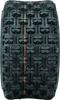 A high-resolution studio product photograph of a QuadBoss QBT739 Series ATV tire in size 20x10-9, set against a clean white background. Displayed at a front-three-quarter angle, the wide rear sport ATV tire features a low-profile design with an aggressive knobby tread pattern, spaced center blocks for optimal acceleration, and tough shoulder lugs for cornering stability. Constructed with a 4-ply rated casing, the durable black rubber tire displays crisp embossed sidewall text including "QUADBOSS", "QBT739", and "20x10-9".
