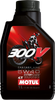 A high-resolution studio product photograph of a 1-liter bottle of Motul 300V Factory Line Off Road 100% Synthetic engine oil in SAE 5W-40 viscosity, set against a clean white background. Standing upright at a front-facing angle, the sleek black plastic container features side grip contours and a black twist-off cap. The distinct front label displays a dark panel featuring a dirt bike motocross rider graphic alongside the iconic red and white "300V" branding, paired with bold white and red "FACTORY LINE", "OFF ROAD", "5W-40", "ESTER Core®", and "1L" callouts above the white "MOTUL" logo set on a red banner.