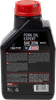 A high-resolution studio product photograph of a bottle of Motul Fork Oil Expert Heavy in SAE 20W viscosity, set against a clean white background. Standing upright at a front-facing angle, the compact white plastic container features a cylindrical base and a bright red twist-off cap. The distinct front label displays a bold orange, black, and red graphic featuring a motorcycle front fork diagram alongside the white "MOTUL" logo on a red base banner, paired with crisp white and yellow "FORK OIL EXPERT", "HEAVY 20W", and "TECHNOSYNTHESE®" callouts.