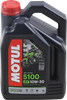 A high-resolution studio product photograph of a 4-liter container of Motul 5100 4T Technosynthese synthetic blend engine oil in 10W-30 viscosity, set against a clean white background. Standing upright at a front-facing angle, the heavy-duty black plastic jug features an ergonomic carrying handle and a red twist-off cap. The dynamic front label prominently displays the bold white "MOTUL" logo vertically alongside a bright green "5100", "10W-30", "ESTER TECHNOSYNTHESE", and "4T MOTOR OIL" callouts, set against a sleek motorcycle silhouette background. Meeting JASO MA2 and API SM/SL specifications, it is formulated to offer fuel economy benefits, low-temperature flow protection, high shear resistance, and smooth wet-clutch operation for four-stroke motorcycle engines.
