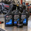 Maxima SXS 10W-50 Polaris oil change kit displayed in a UTV workshop