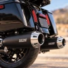 Vance & Hines Torquer 450 4.5-inch machine cut slip-on mufflers mounted on a Harley-Davidson Touring motorcycle
