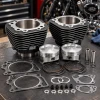 S&S Cycle 3-5/8-inch Big Bore Cylinder and Piston Kit 91-9001 displayed on a motorcycle workshop bench