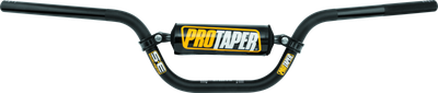 Front view of the anodized black ProTaper SE KLX/DRZ110 handlebar featuring a cold-forged crossbar, black bar pad with white lettering, and pre-fit end plugs on a white background.