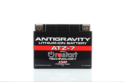 Antigravity Batteries ATZ7-RS lithium RE-START engine starting battery built inside a matte-black YTZ7 OEM size case envelope layout, highlighting its distinct top-mounted 4-terminal block setup and casing reset button, shown next to its accompanying wireless remote keyfob and hardware bolts against a clean white backdrop.
