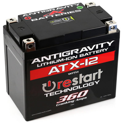 Antigravity Batteries ATX12-RS lithium RE-START engine starting battery built inside a heavy-duty matte-black YTX12 OEM size case envelope layout, highlighting its distinct top-mounted 4-terminal block setup and casing reset button, shown next to its accompanying wireless remote keyfob and hardware bolts against a clean white backdrop.