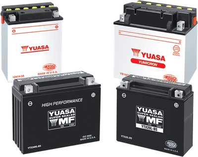 Yuasa YTX20HL-BS YUAM620BH maintenance-free AGM motorcycle battery showing its rugged black poly-propylene casing with a black top layout, featuring flush-mounted lead terminal blocks with left-side positive and right-side negative orientation, displayed next to its un-opened 0.93-liter clear plastic electrolyte acid pack and silver mounting bolts on a plain white backdrop.