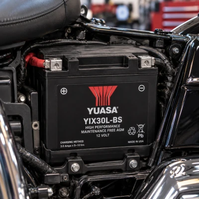 Yuasa YIX30L-BS high-performance AGM battery installed in a motorcycle battery compartment