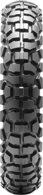 A professional studio product photograph of the Dunlop D605 dual-sport rear motorcycle tire in 4.60-18 63P sizing, isolated against a seamless, solid white background. The tire is standing upright at a three-quarter perspective to showcase its versatile 50/50 street-and-trail tread design. The layout features block-style center tread lugs engineered for smooth highway tracking and tread longevity, flanked by aggressive, self-cleaning shoulder knobs for off-road cornering traction on gravel, dirt, and light trail terrain, with clean embossed sidewall branding on its matte black rubber casing.