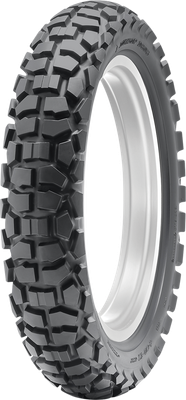 A professional studio product photograph of the Dunlop D605 dual-sport rear motorcycle tire in 4.60-18 63P sizing, isolated against a seamless, solid white background. The tire is standing upright at a three-quarter perspective to showcase its versatile 50/50 street-and-trail tread design. The layout features block-style center tread lugs engineered for smooth highway tracking and tread longevity, flanked by aggressive, self-cleaning shoulder knobs for off-road cornering traction on gravel, dirt, and light trail terrain, with clean embossed sidewall branding on its matte black rubber casing.