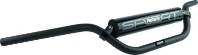 A high-resolution studio product photograph of the ProTaper ATV Aluminum Handlebar in a sleek matte black finish, set against a clean white background. Displayed from a front perspective angle, the handlebar features high-strength aerospace 2000-series T6 aluminum construction with a standard 7/8-inch diameter throughout. Designed with ATV-specific geometry offering increased rise and sweep for optimal quad ergonomics, it includes a cold-forged aluminum crossbar, stainless steel hardware, and a high-density vinyl-covered crossbar pad with signature ProTaper branding.