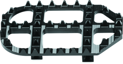 A high-resolution studio product photograph of a ProTaper Footpeg Cleat Kit (-5mm) in Black, set against a clean white background. Displayed at a three-quarter angle, the precision CNC-machined 7075-T6 billet aluminum replacement cleat features a durable black anodized finish, aggressively patterned outer teeth for maximum boot traction, open mud-clearing cutouts, and bottom mounting posts. The -5mm offset lowers the footpeg platform by 5mm relative to stock height to offer taller riders expanded cockpit room and improved ergonomics.