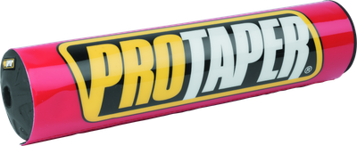 A high-resolution studio product photograph of a ProTaper Molded 10-inch Round Bar Pad in vibrant red, set against a clean white background. Displayed at a front-three-quarter angle, the full-size 10-inch cylindrical high-density molded foam pad features a glossy bright red vinyl cover, bold yellow and white "PROTAPER" block logo graphics across the front, and durable black molded rubber end caps designed for full-size crossbar handlebars.