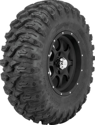 A high-resolution studio product photograph of a QuadBoss QBT446 Radial Utility UTV tire in size 30x10R14, set against a clean white background. Displayed at a front-three-quarter angle, the heavy-duty radial all-terrain utility UTV tire features a non-directional, multi-surface tread design with tight center lugs for a smooth ride on hardpack and wrapped shoulder lugs for aggressive side-bite and cornering control. Constructed with an 8-ply rated radial carcass, the durable black rubber casing displays crisp embossed sidewall text including "QUADBOSS", "QBT446", and "30x10R14".