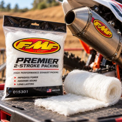 FMF Premier 2-Stroke packing beside a motocross motorcycle silencer