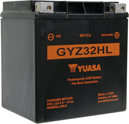 Yuasa GYZ32HL YUAM732GHL factory activated maintenance-free heavy duty AGM battery showing its rugged black poly-propylene casing with a solid black top layout, featuring molded copper-alloy terminal inserts with left-side negative and right-side positive orientation, isolated against a solid white studio background.