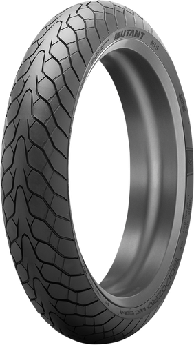 A high-resolution studio product photograph of the Dunlop Mutant front crossover motorcycle tire in 110/70ZR17 54(W) sizing, isolated against a bright, solid white background. The tire is shown standing upright at a three-quarter perspective to highlight its signature all-weather crossover tread geometry. The design features aggressive directional grooving, dense siping for wet-weather traction, and a distinct multi-segment block pattern engineered for light sports, naked, and crossover motorcycles, complete with clean embossed "MUTANT" branding and sizing specifications along its matte black rubber sidewall.
