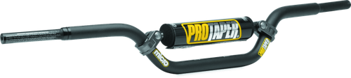 A high-resolution studio product photograph of the ProTaper Micro Schoolboy Pro Handlebar in a black finish, set against a clean white background. Displayed from a front-facing studio angle, the handlebar is precision-manufactured from high-strength 2000-series T6 aluminum alloy with a cold-forged crossbar. Tailored specifically for advancing youth racers transitioning on 65cc and 85cc mini motorcycles, it features ProTaper's specialized abrupt-taper design with reduced-diameter grip ends to allow smaller hands a firm, natural wrap for enhanced control and safety, while maintaining a standard 7/8-inch clamp and control section. The bar features knurled clutch-side tubing to prevent grip slippage, laser-etched alignment grid markings for precise positioning, and a high-density crossbar pad with signature ProTaper branding.