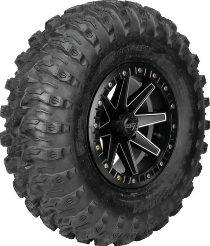 A high-resolution studio product photograph of a QuadBoss QBT446 Radial Utility UTV tire in size 30x10R14, set against a clean white background. Displayed at a front-three-quarter angle, the heavy-duty radial all-terrain utility UTV tire features a non-directional, multi-surface tread design with tight center lugs for a smooth ride on hardpack and wrapped shoulder lugs for aggressive side-bite and cornering control. Constructed with an 8-ply rated radial carcass, the durable black rubber casing displays crisp embossed sidewall text including "QUADBOSS", "QBT446", and "30x10R14".