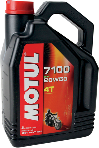 A high-resolution studio product photograph of a bulk 4-liter container of Motul 7100 4T 100% Synthetic engine oil in 20W-50 viscosity, set against a clean white background. Standing upright at a front-facing angle, the heavy-duty matte black plastic jug features an ergonomic integrated top handle, side grip ridges, and a red twist-off cap. The distinct front label displays a dark panel featuring a V-twin cruiser motorcycle graphic alongside the white "MOTUL" logo set on a bold red banner, paired with bright orange and white "7100", "20W-50", "100% SYNTHETIC", and "ESTER" callouts.